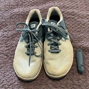 Teal and light blue Nike Metcon training shoes